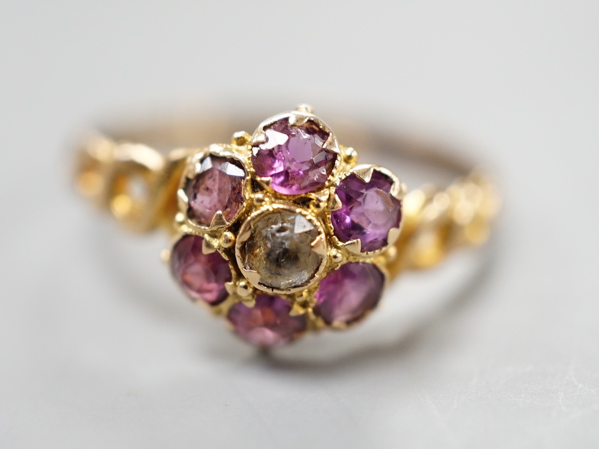 A late Victorian 15ct gold amethyst and quartz? cluster set dress ring, size P, gross weight 1.3 grams, with pierced ring shoulders.